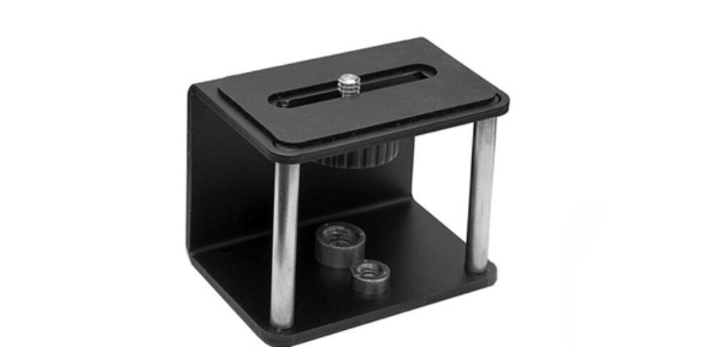 Compact black camera accessory mount with adjustable screws.